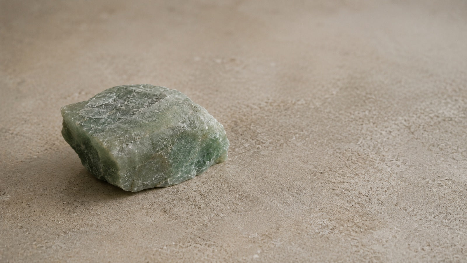 Raw green aventurine stone with soft natural green surface