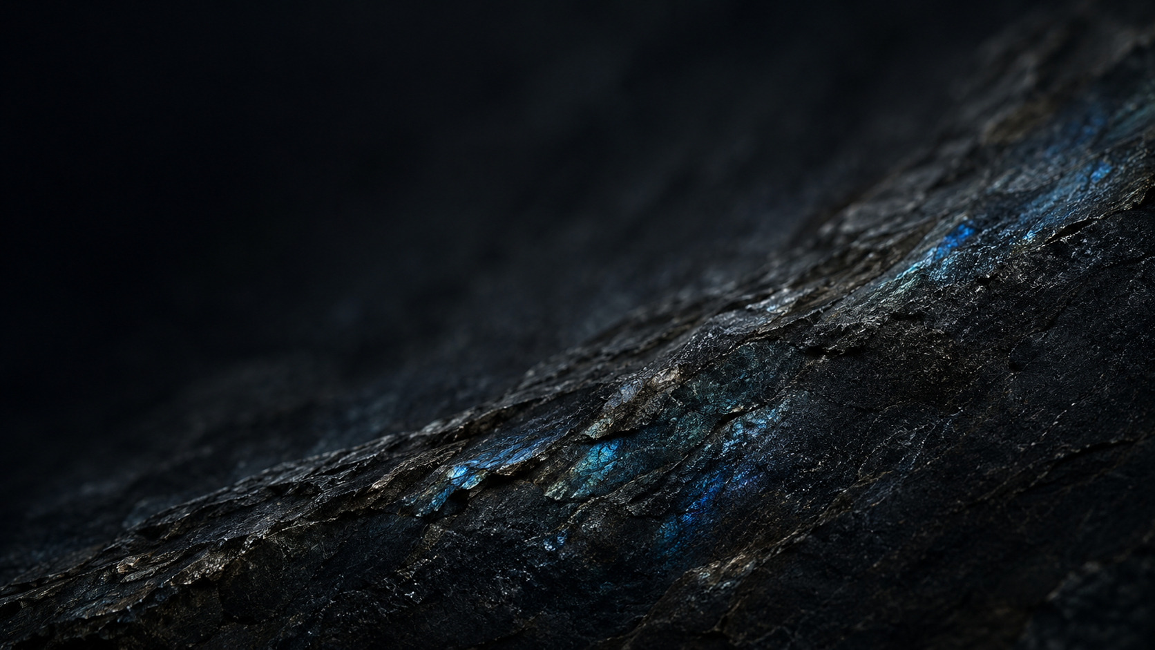 L&H Atelier Stone Library dark labradorite mineral surface with blue flashes