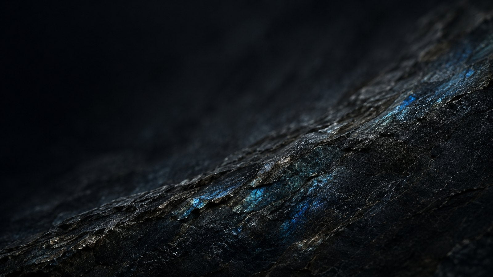 L&H Atelier Stone Library dark labradorite mineral surface with blue flashes