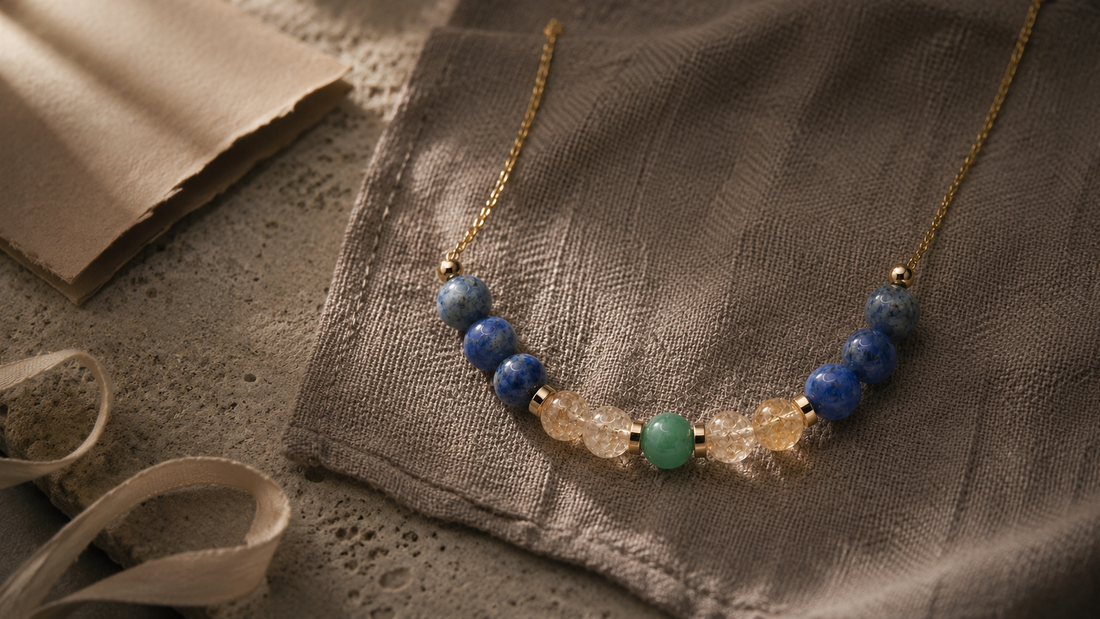Natural stone zodiac necklace on tactile linen for L&H Atelier meaningful jewelry gifts Journal cover